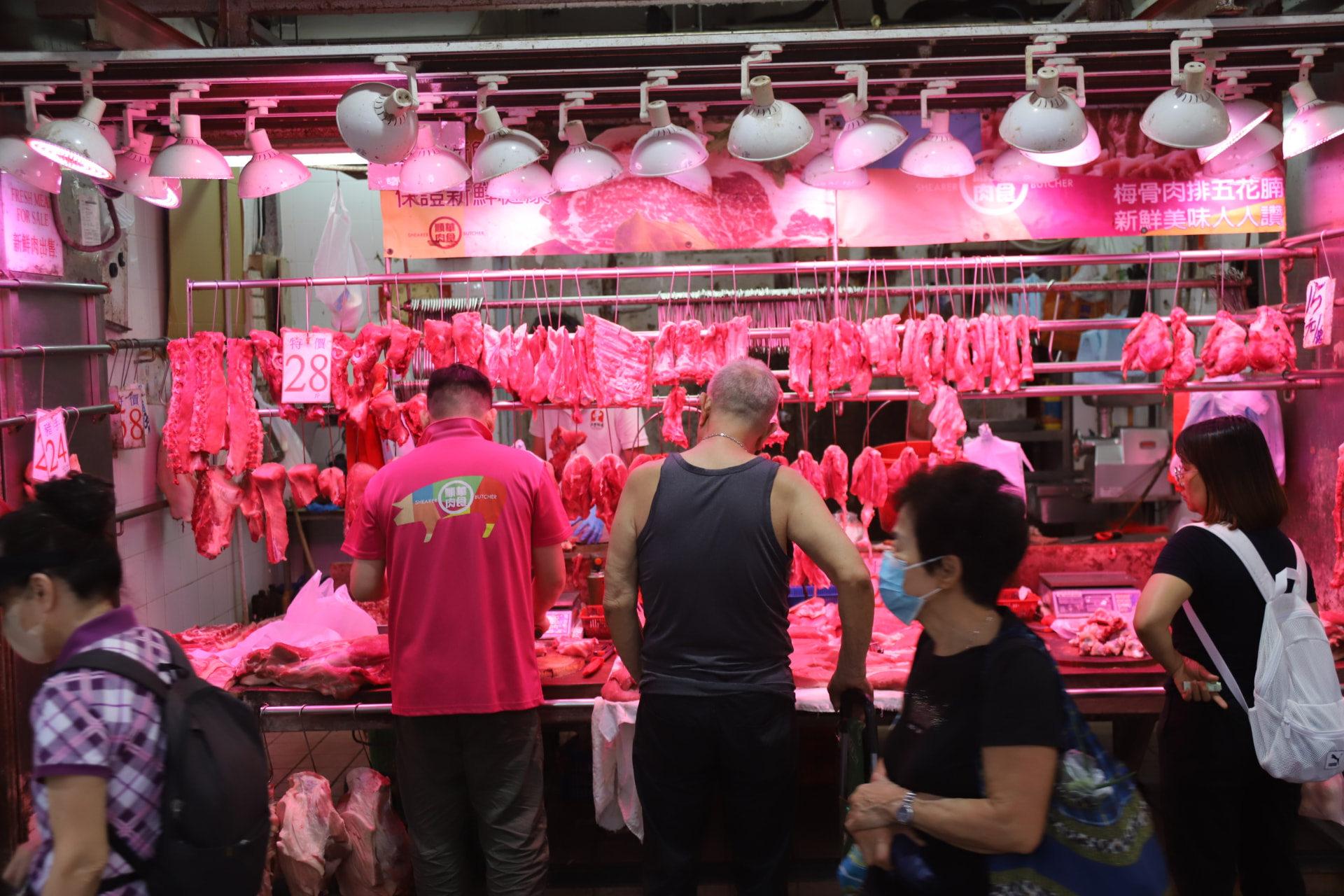 Hong Kong meat market bathed in pink light