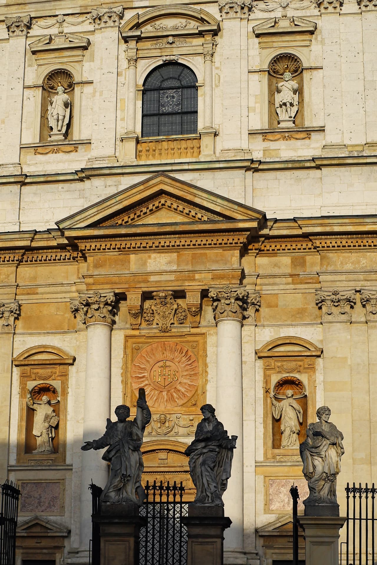 Ornate baroque church facade in warm evening light